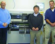 Next to the i-Pulse machine (from left): Zalman Orlianski, managing director, Zetech; Kazuhiro Kurino, European service manager, i-Pulse; Sean Hurley, managing director, IO Tech